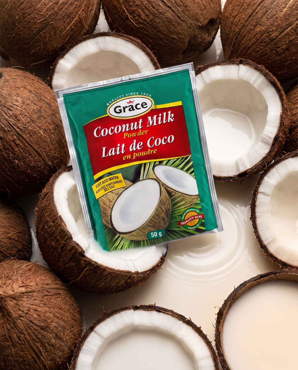 Front view of Grace Coconut Milk Powder packet showcasing 50 g size and just add water message with whole and halved coconuts