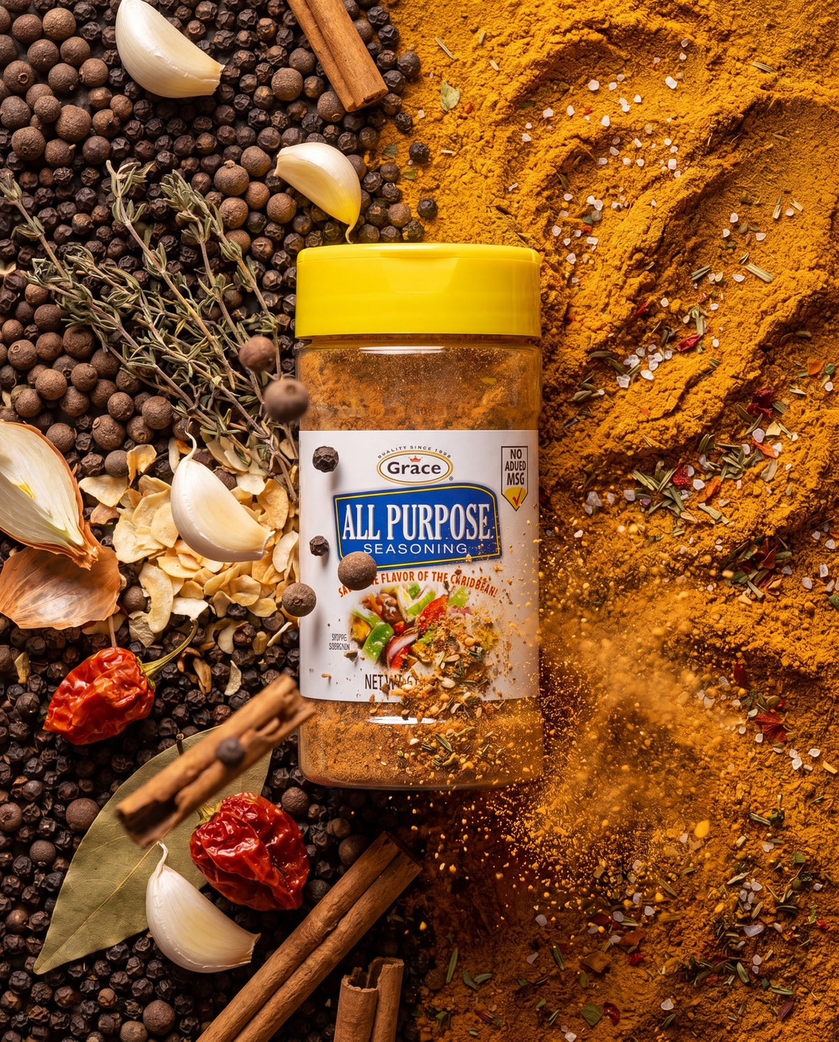 Front view of Grace All Purpose Seasoning jar showing no added MSG, surrounded by whole spices and ground seasoning