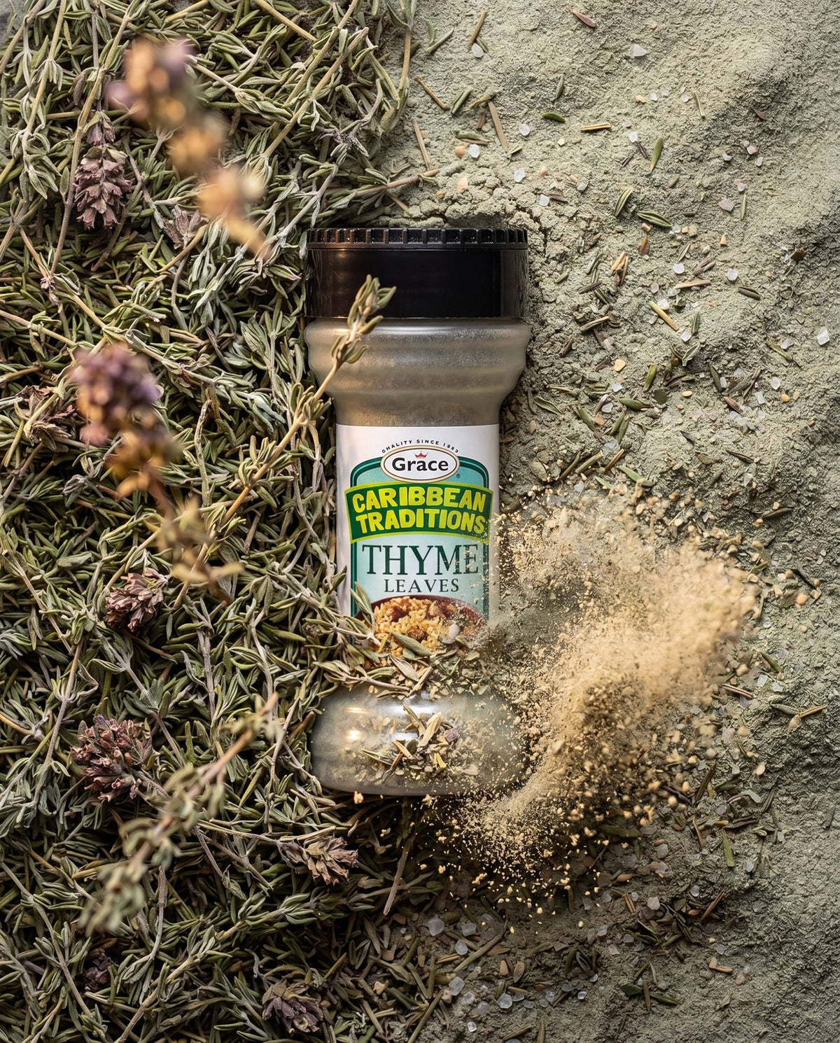 Front view of Grace Caribbean Traditions Thyme Leaves bottle showcasing the thyme leaves label with scattered dried herbs