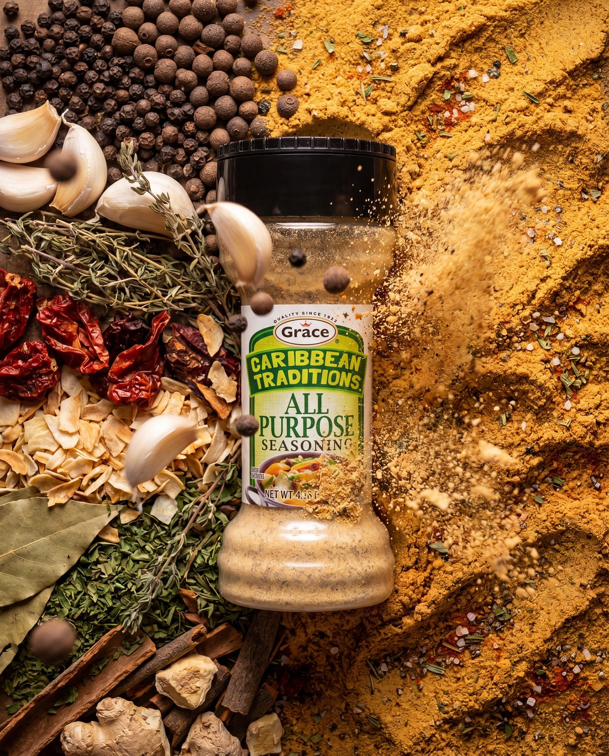 Front view of Grace Caribbean Traditions All Purpose Seasoning bottle with its label surrounded by spices and herbs