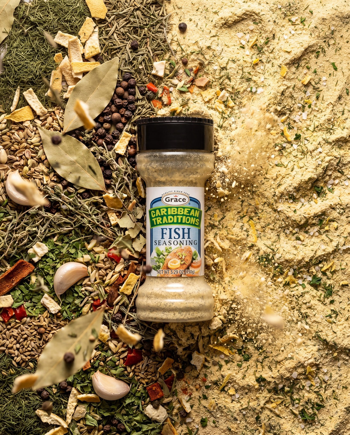 Front view of Grace Caribbean Traditions Fish Seasoning, a 5.29 oz bottle surrounded by herbs and spices