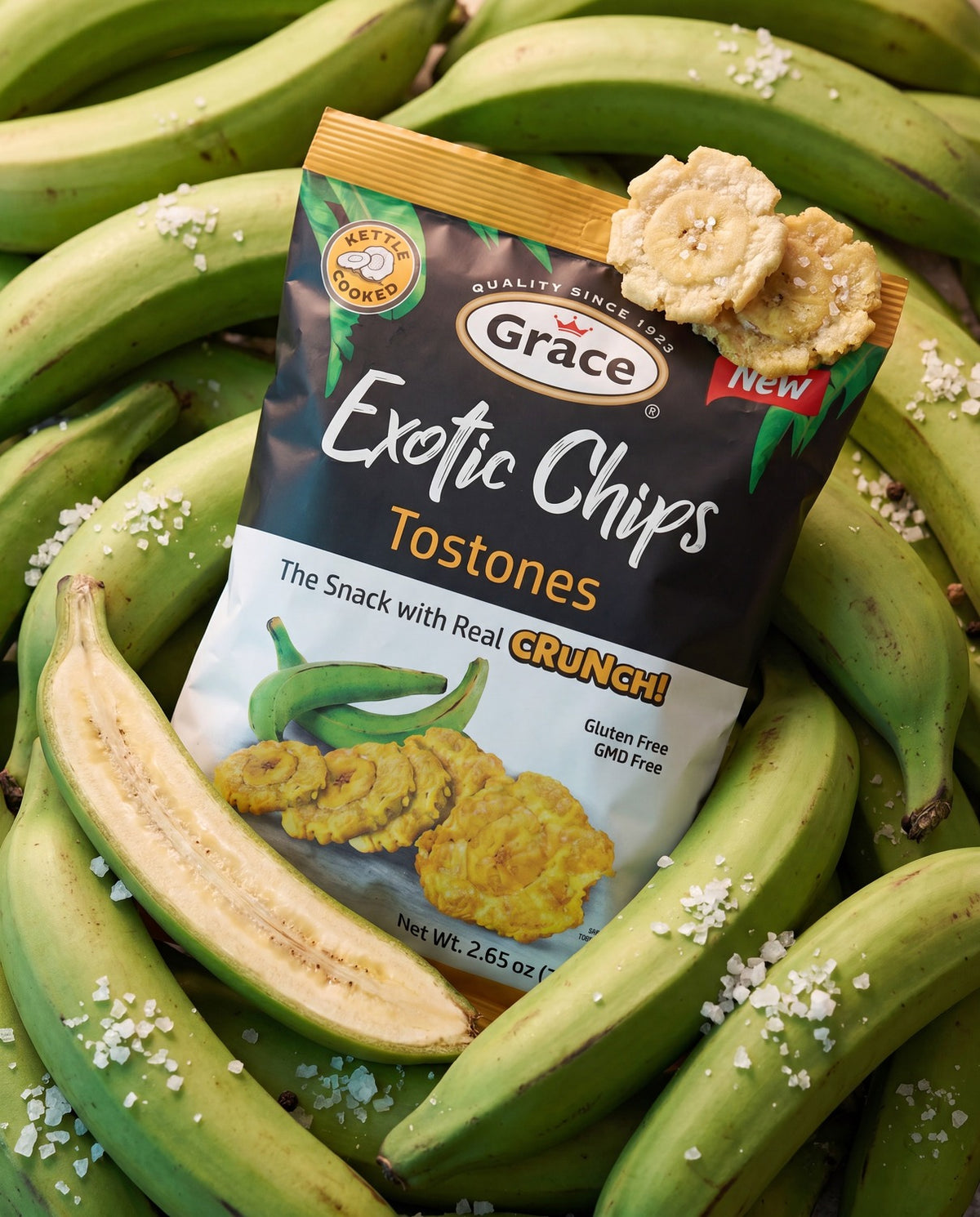 Angled view of Grace Exotic Chips Tostones bag showcasing golden plantain chips with green plantains in the background