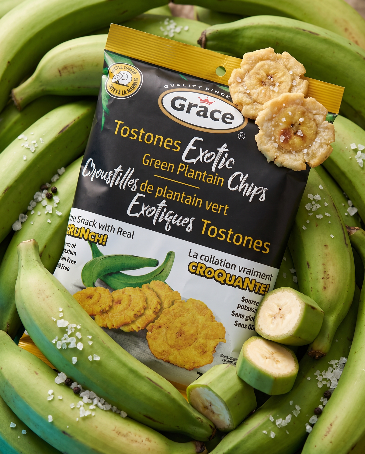 Front view of Grace Exotic Chips Tostones bag showcasing green plantain chips with whole and sliced green plantains in background
