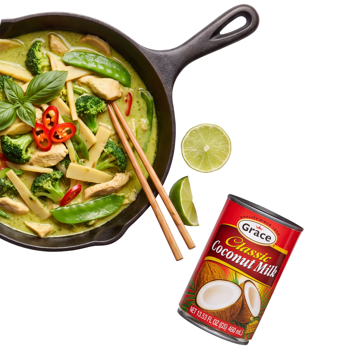 Grace Coconut Milk carton beside a skillet of creamy curry with vegetables, lime, basil, chicken, and chopsticks