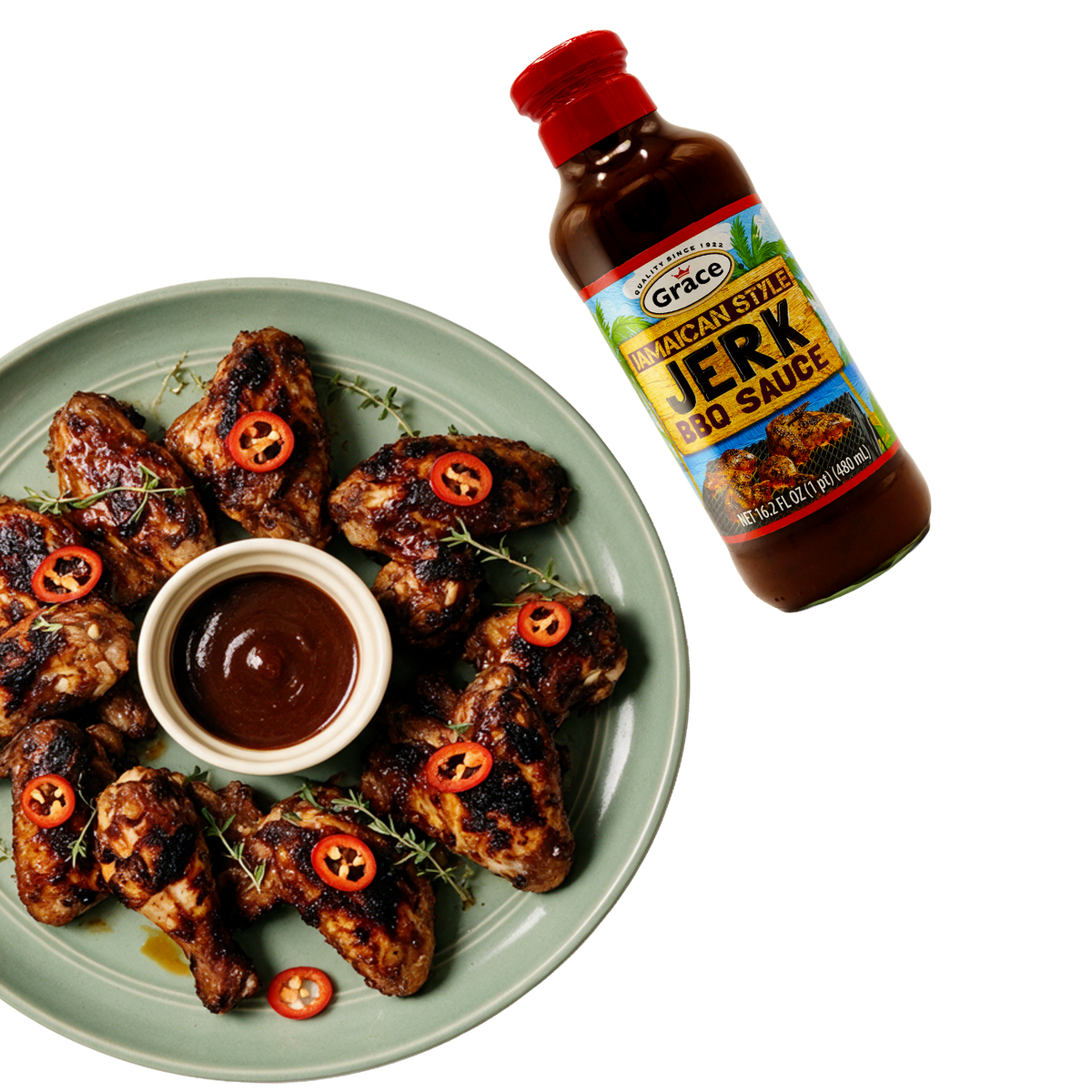 Angled view of Grace Jamaican Style Jerk BBQ Sauce bottle marked 16.2 fluid ounces beside grilled wings and dipping sauce